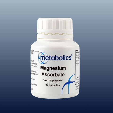 White bottle of Metabolics Magnesium Ascorbate supplement on a gradient blue background