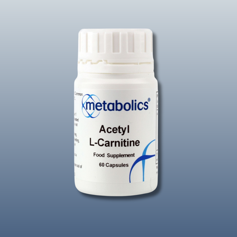 White supplement bottle labeled 'Acetyl L-Carnitine' by 'metabolics' on a gray background