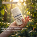 Hand holding a bottle of Metabolics Vitamins D3 & K2 supplement with a natural background
