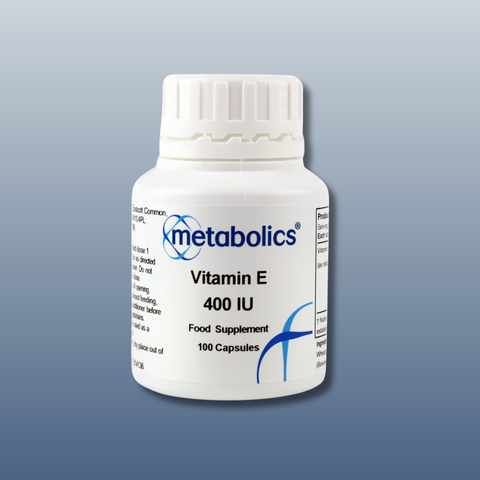 Bottle of Metabolics Vitamin E 400 IU supplement on a gray background