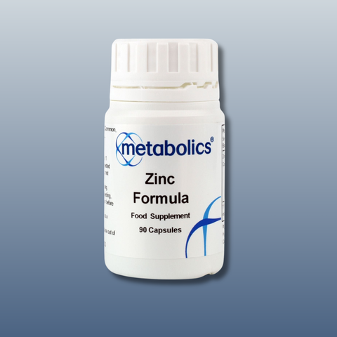 White supplement bottle labeled 'metabolics Zinc Formula' on a gray background