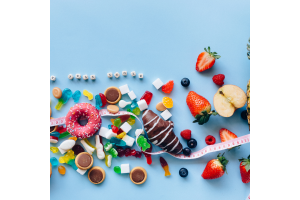 Sugary snacks on a blue background with a tape measure